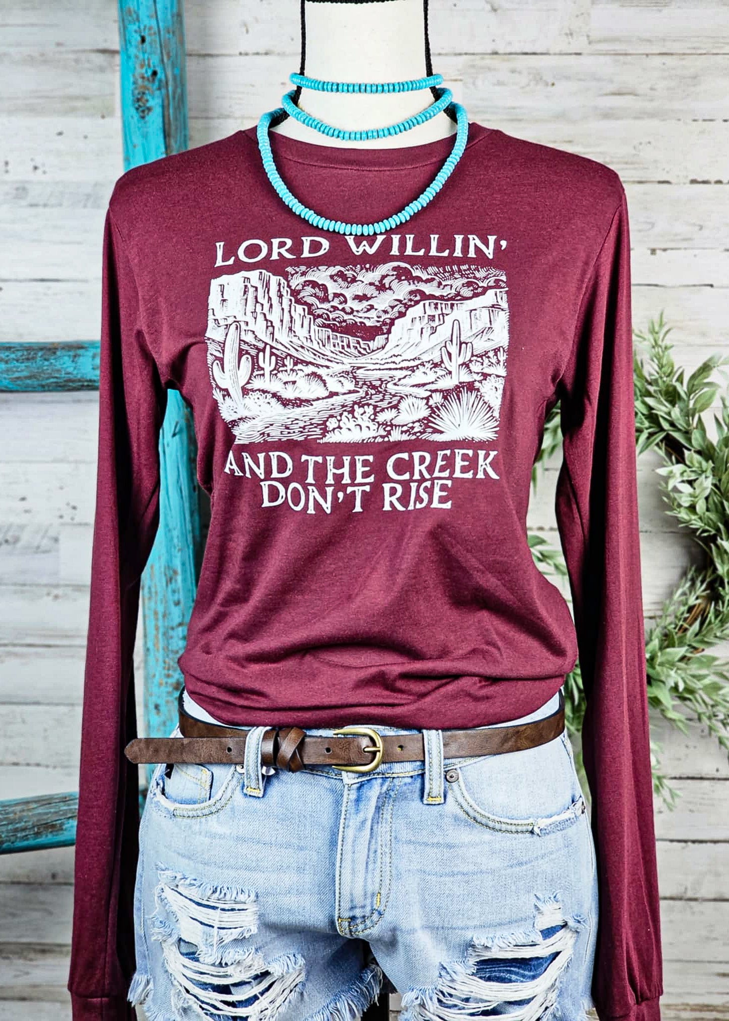 Heather Cardinal Lord Willin' & Creek Don't Rise Long Sleeve Graphic Tee tcc graphic tee The Cinchy Cowgirl