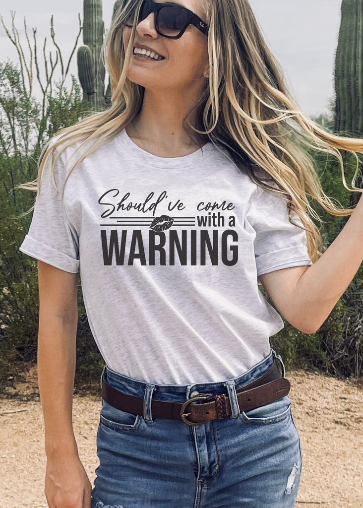 Come With A Warning Short Sleeve Tee [4 Colors] tcc graphic tee - $19.99 The Cinchy Cowgirl Small Ash 