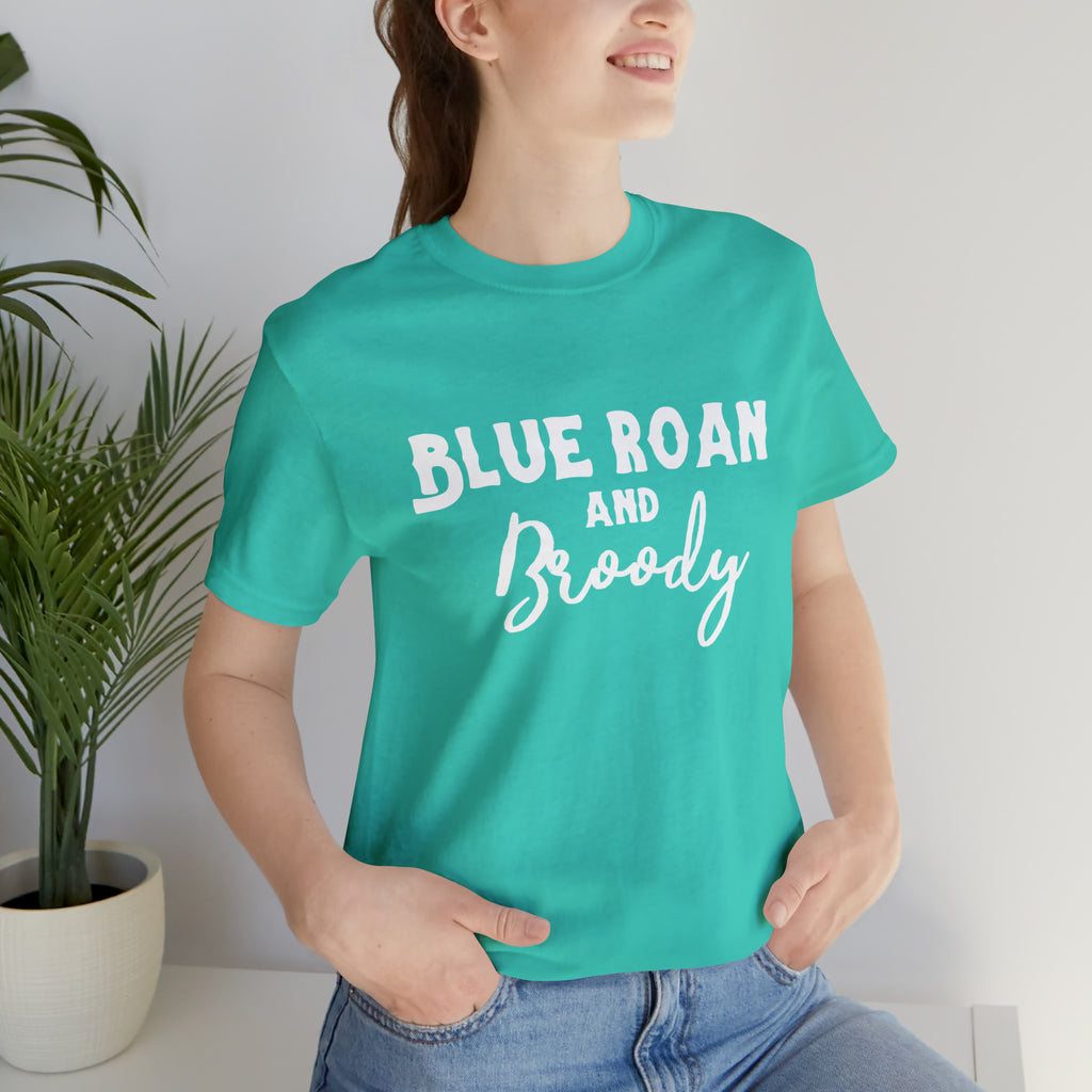 Teal short sleeve with white lettering reading "Blue Roan and Broody". 