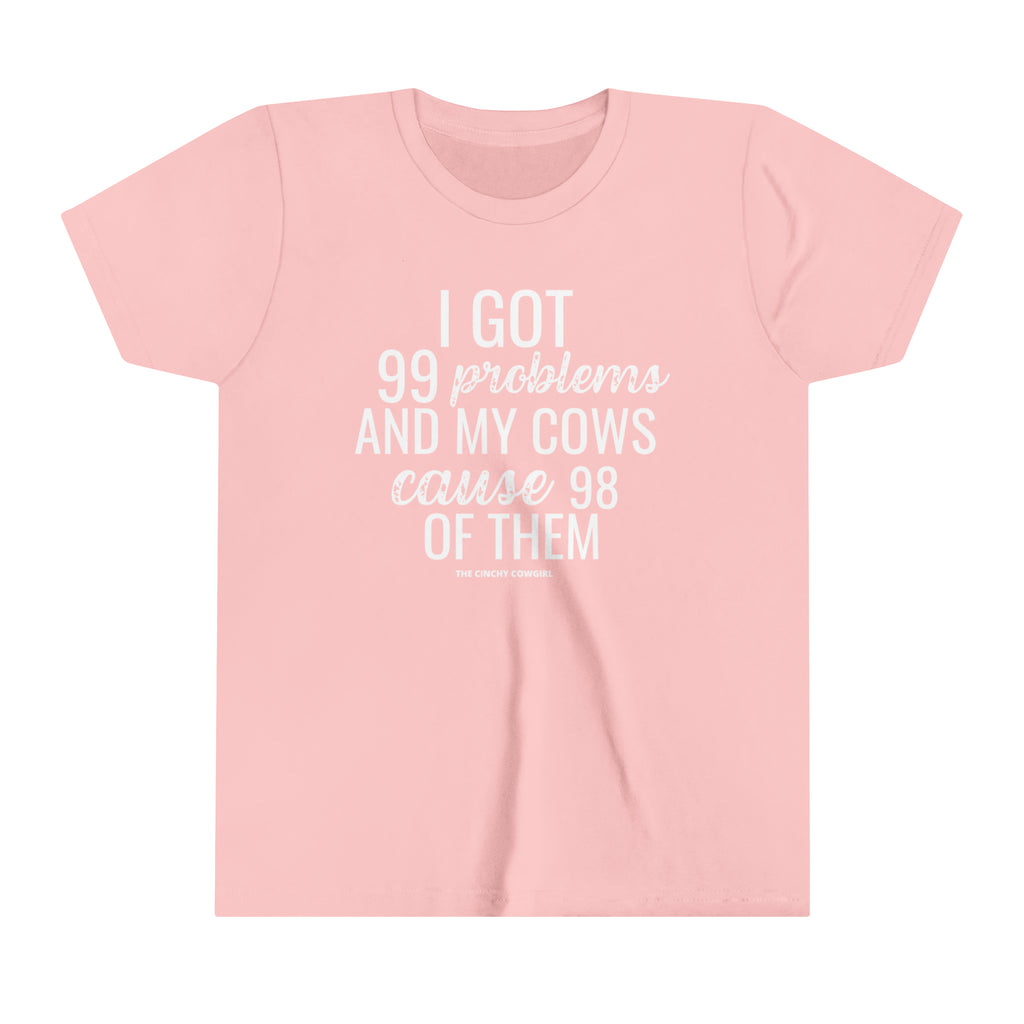 Pink youth short sleeve tee with white lettering reading "I got 99 problems and my Cows cause 98 of them".