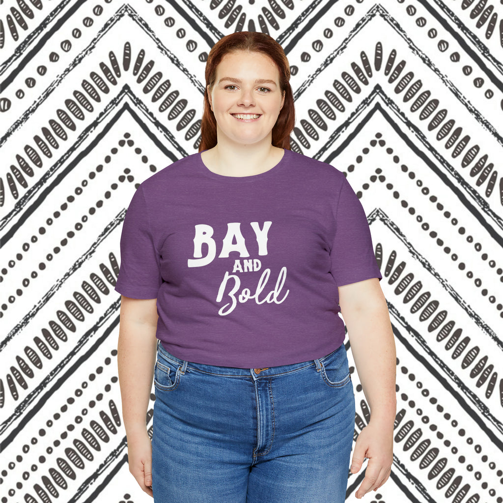 Purple short sleeve with white lettering reading "Bay and bold".