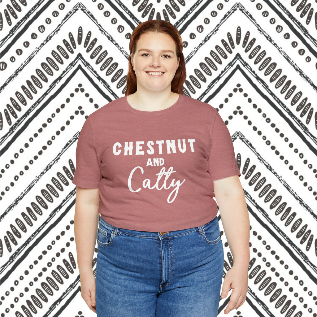 Mauve plus size short sleeve with white lettering reading "Chestnut and Catty". 