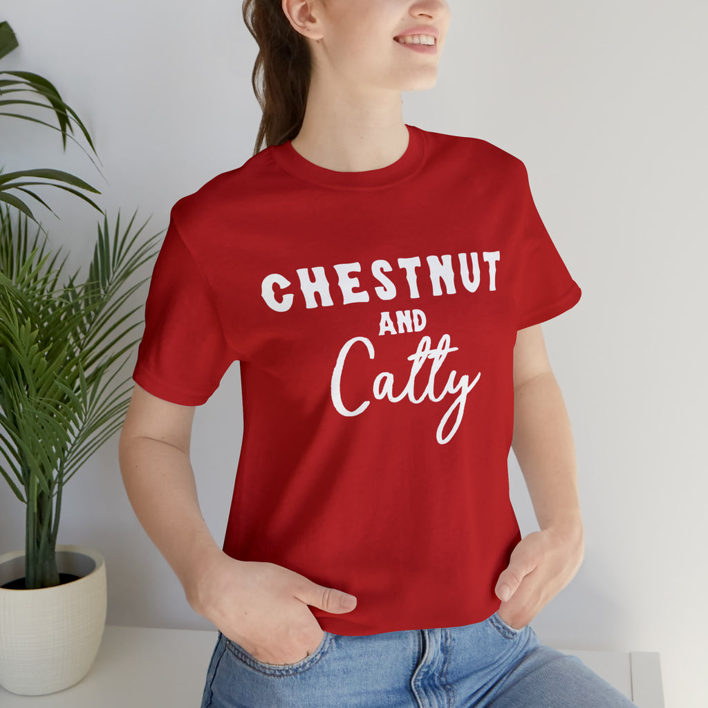 Red short sleeve with white lettering reading "Chestnut and Catty". 
