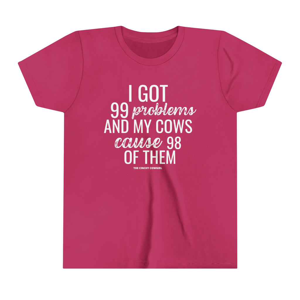 Berry youth short sleeve tee with white lettering reading "I got 99 problems and my Cows cause 98 of them".