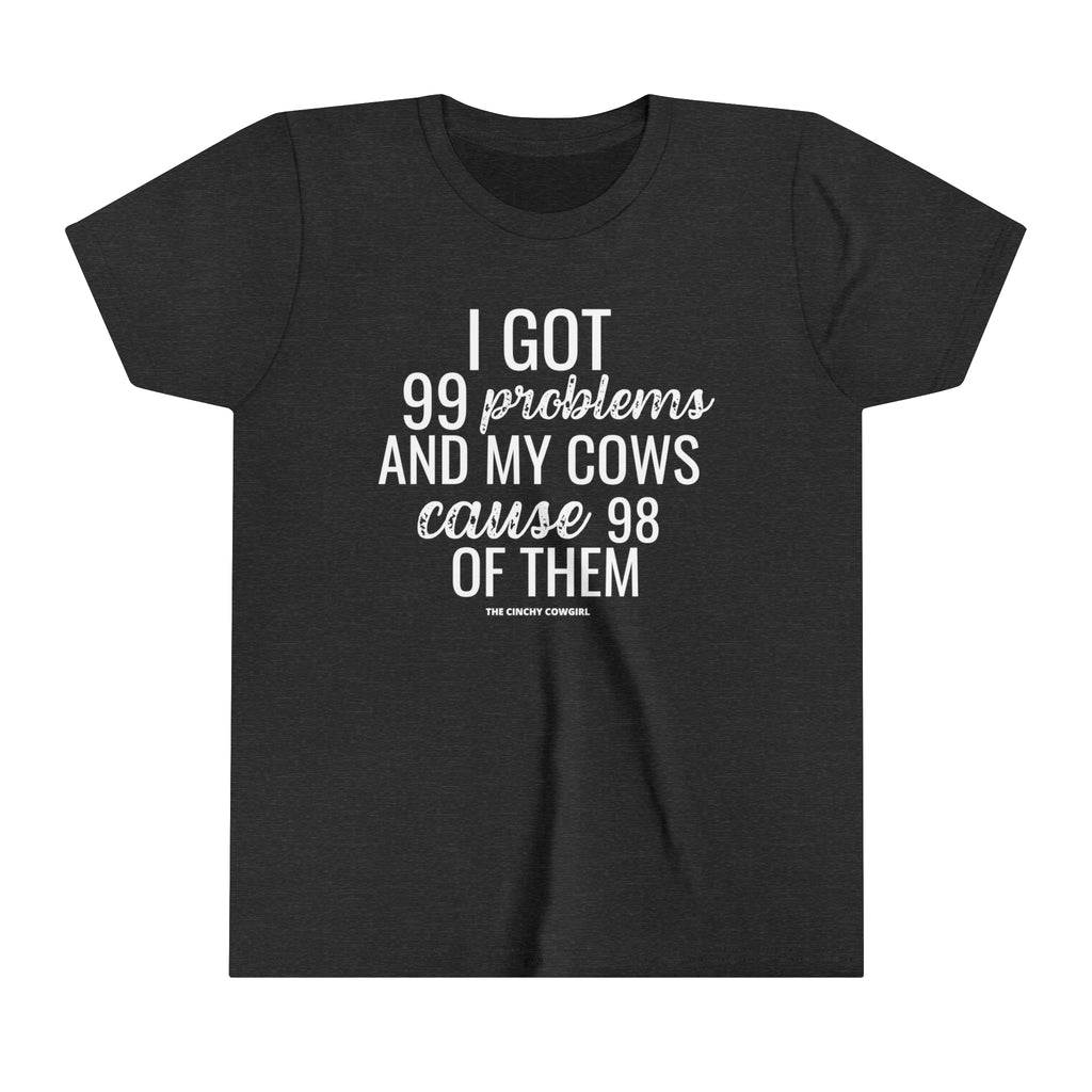 Dark grey youth short sleeve tee with white lettering reading "I got 99 problems and my Cows cause 98 of them".