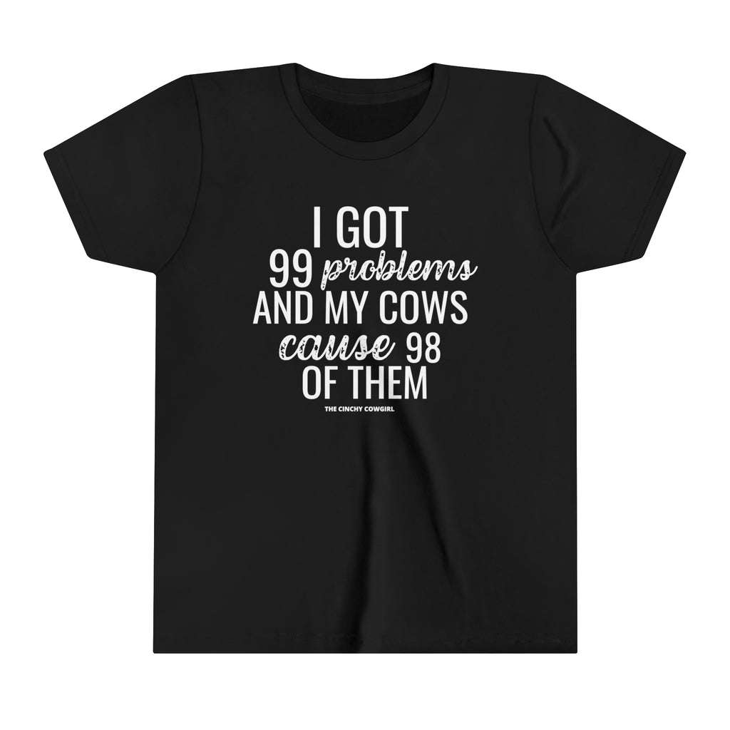 Black youth short sleeve tee with white lettering reading "I got 99 problems and my Cows cause 98 of them".