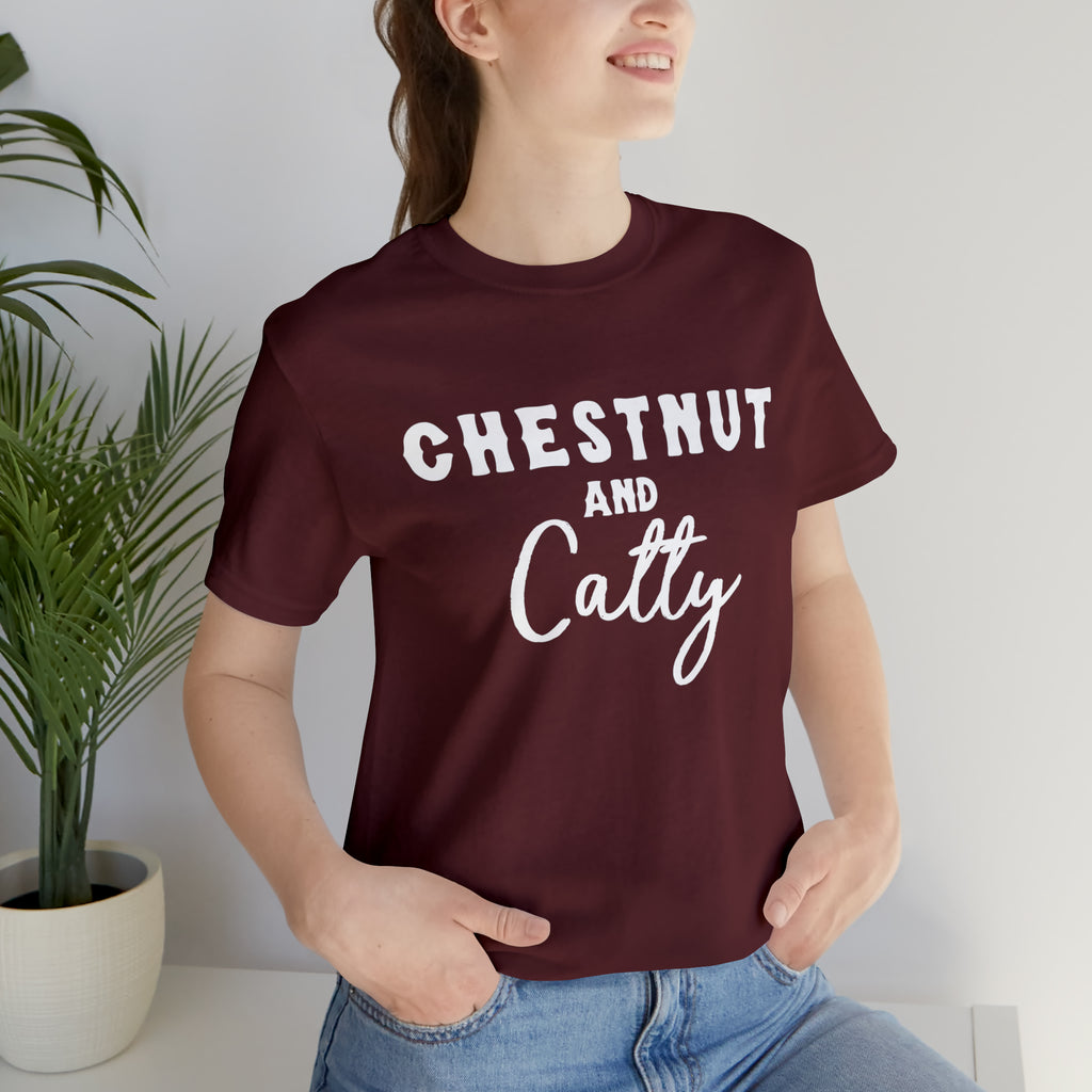Maroon short sleeve with white lettering reading "Chestnut and Catty". 