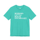 Working Cattle Builds Vocabulary Short Sleeve Tee T-Shirt The Cinchy Cowgirl - Print Teal XS