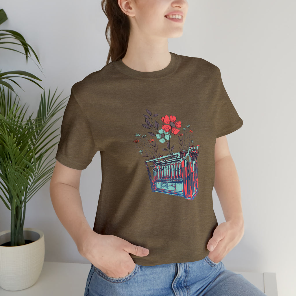 Heather olive short sleeve with flower teal and pink chute in the middle of the tank. 