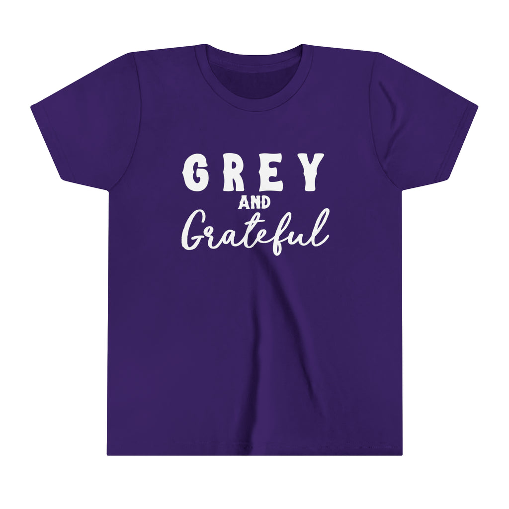 Purple youth short sleeve with white lettering reading "Grey and Grateful". 