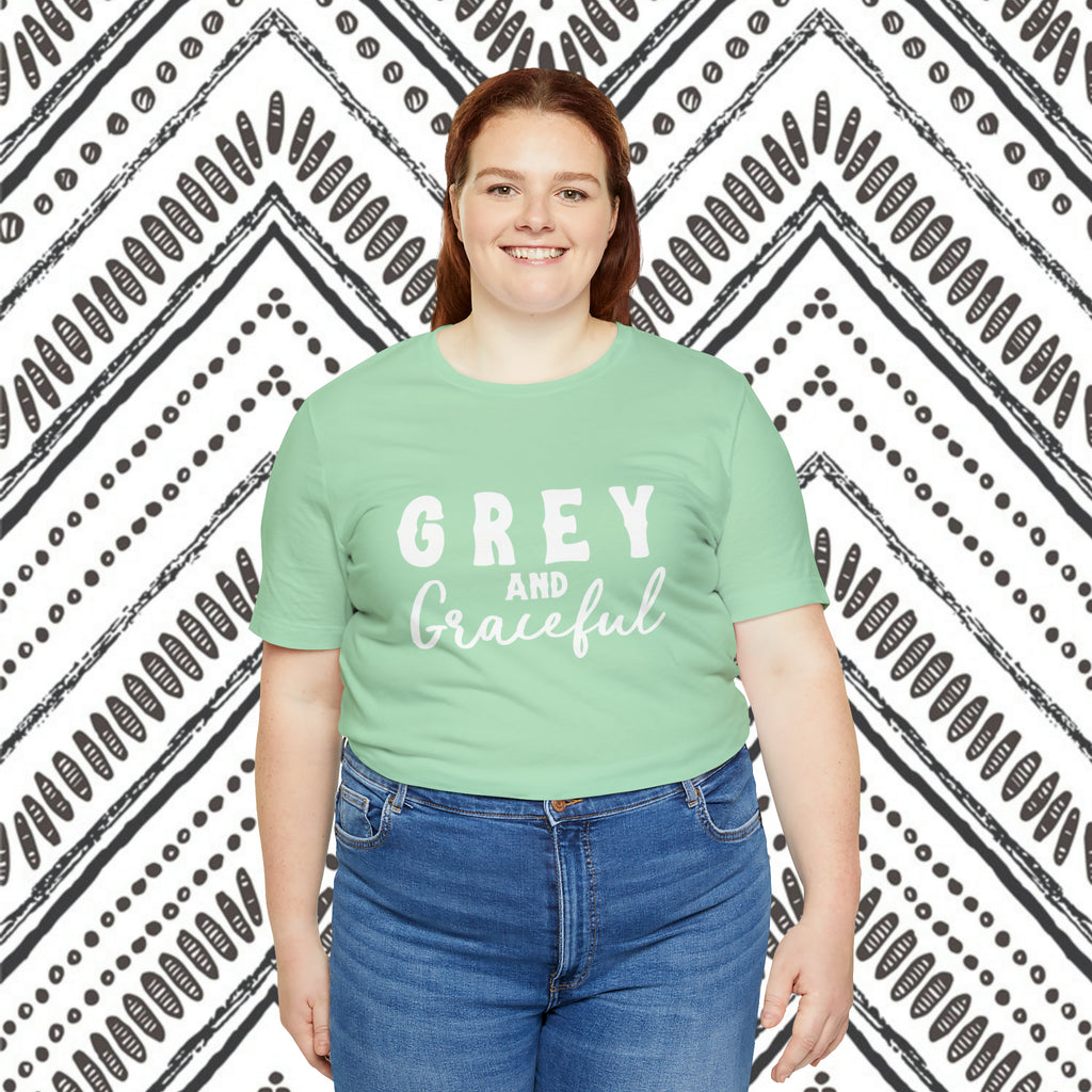 Mint plus size short sleeve with white lettering reading "Grey and Graceful". 