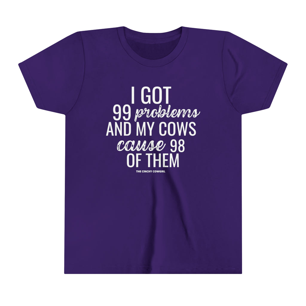 Purple youth short sleeve tee with white lettering reading "I got 99 problems and my Cows cause 98 of them".