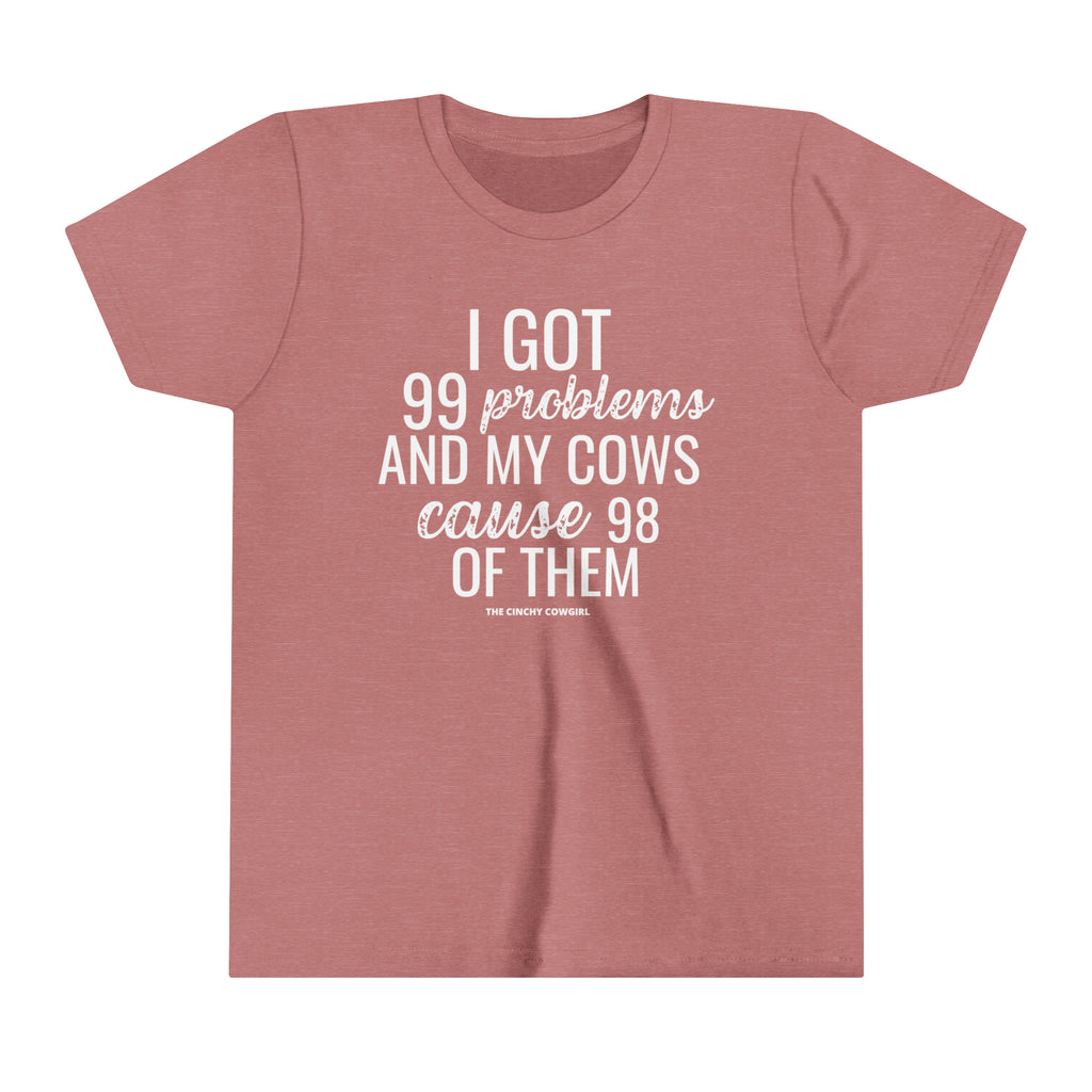 Mauve youth short sleeve tee with white lettering reading "I got 99 problems and my Cows cause 98 of them".