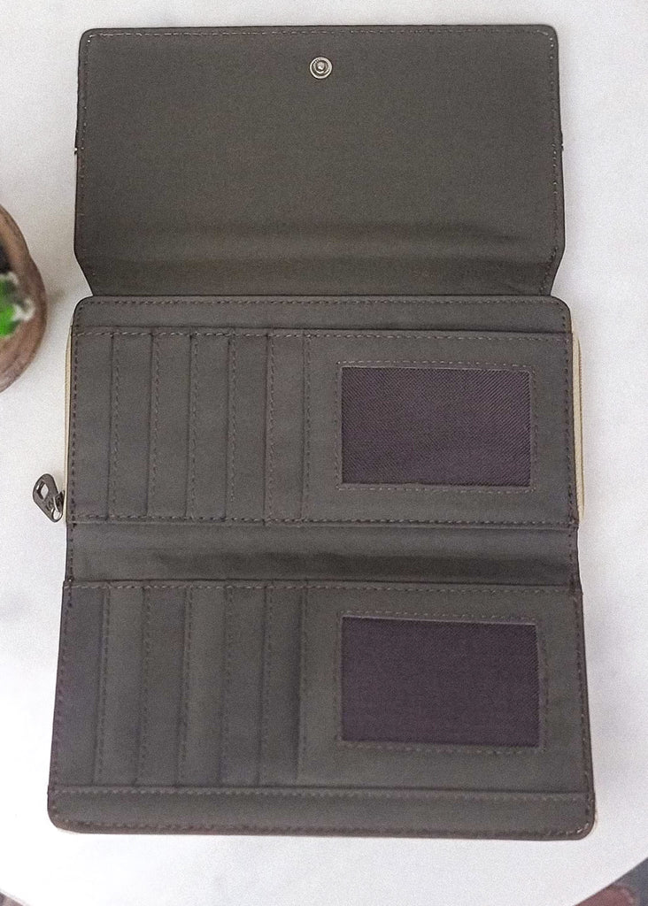 Tan wallet with dark floral embossment inside