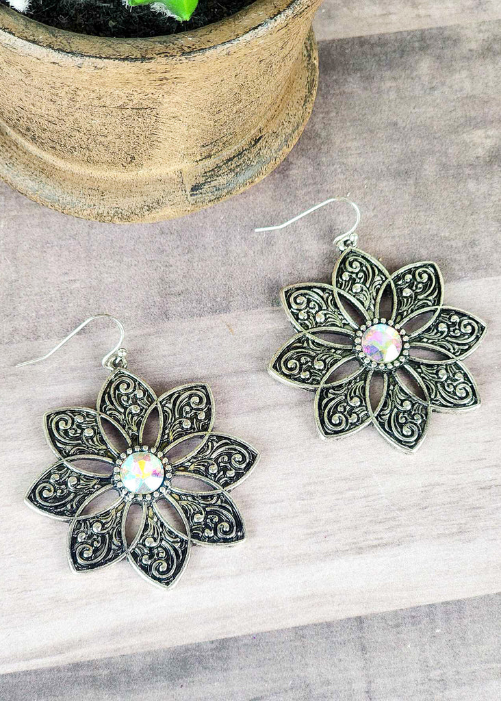 Cowgirl antique silver floral earrings with jewel stone that changes color in different lighting. 