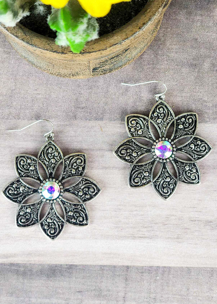 Cowgirl antique silver floral earrings with jewel stone that changes color in different lighting. 