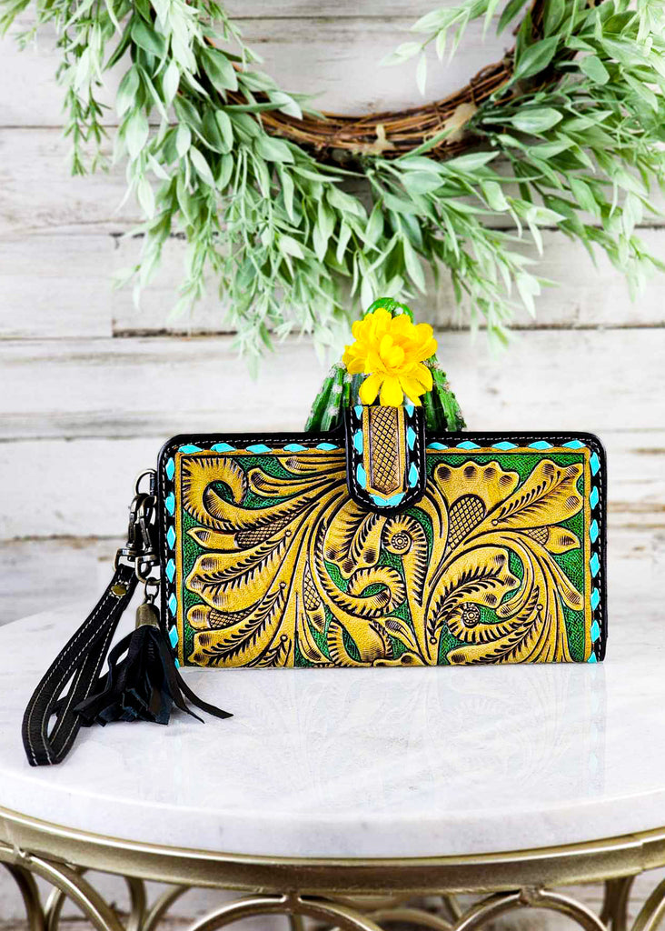 Cowgirl turquoise tooled wallet/wristlet. Fun turquoise buckstitch and fringe attachment on wristlet. 