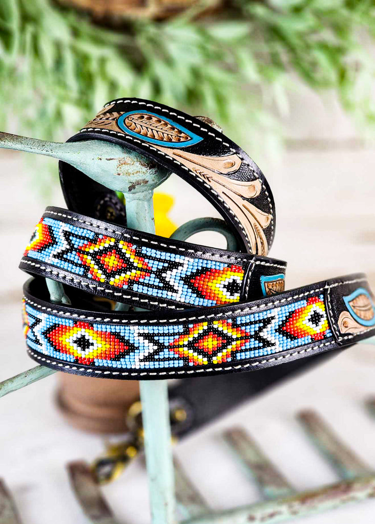 Coiled southwestern designed beading with blue, white, orange, yellow, and black on display. 