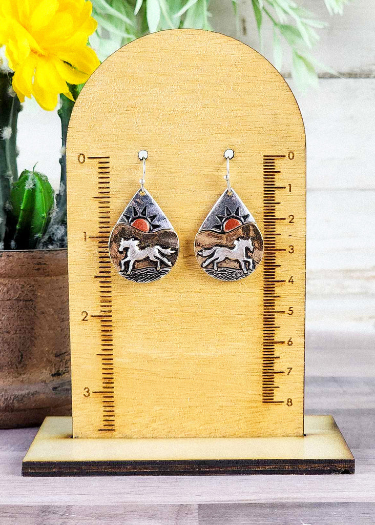 Beautiful western dream earring with a wild horse and mountainous sunset scenery made out of antique silver. 