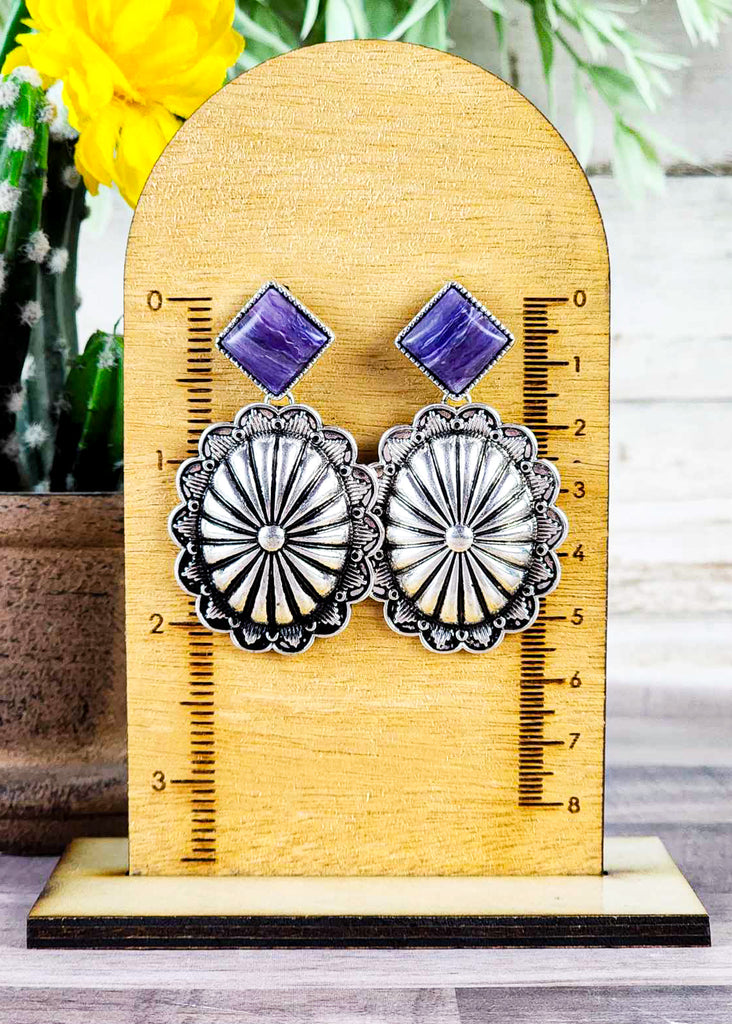 Measurement of western concho and purple stone stud earring. Measures at about 2.25". 