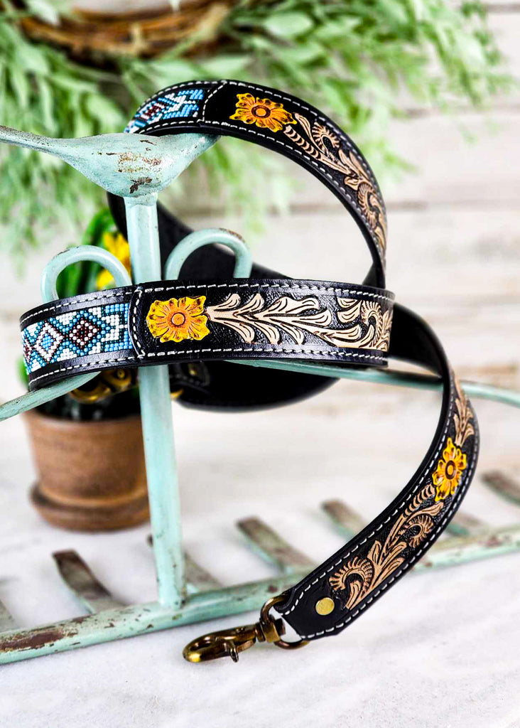 Cowgirl style floral tooling and teal, red and white beading. Bronze strap allowing easy attach to purse. 