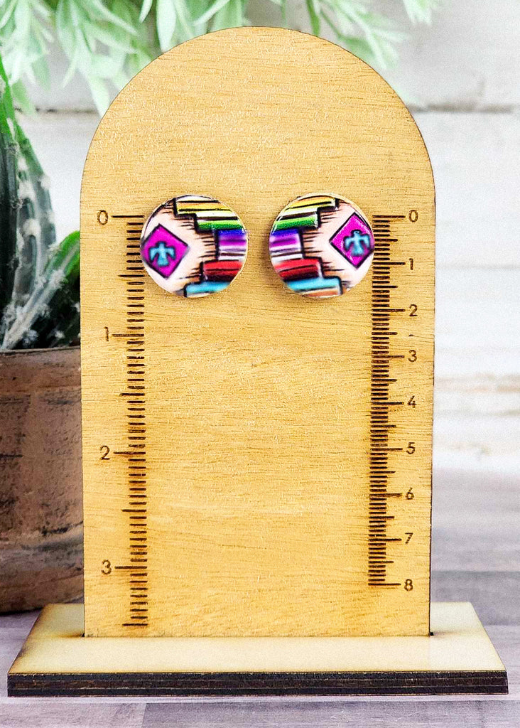 Southwestern style earrings with tooled aztec design, painted thunder bird, and painted to remind you of land to sunset sky. 