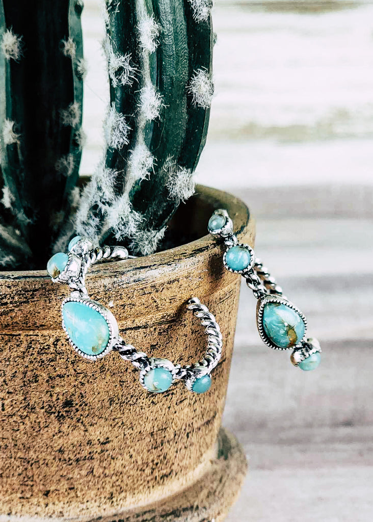 Sophistacated southwestern hoop stud earrings with twisted  antique silver and 5 turquoise-like stones. 