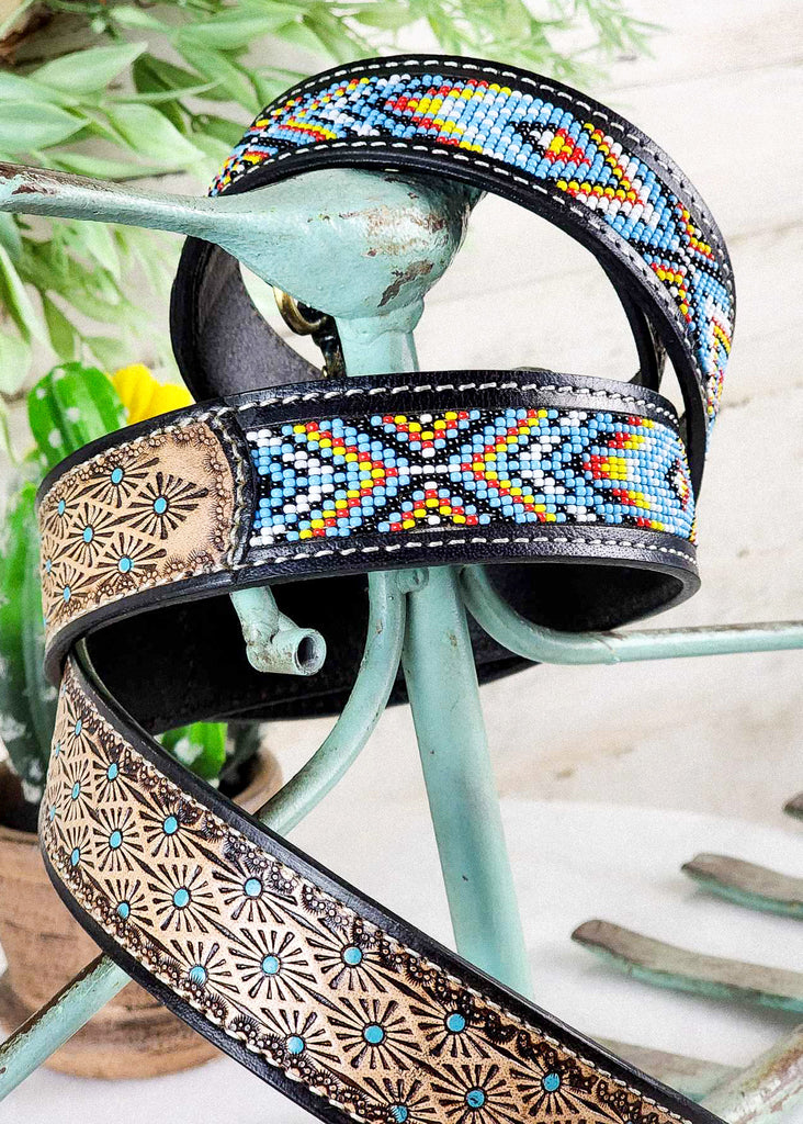 Coiled southwestern color beading that would remind you of the western sky. Hand-tooling suns with teal accents. 