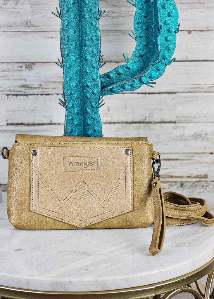 Tan clutch and potential crossbody. Shoulder strap lays beside clutch. 