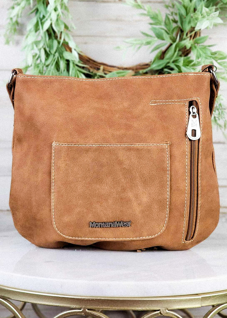 Western concealed carry bag with back zipper concealed carry pocket and open pocket. 