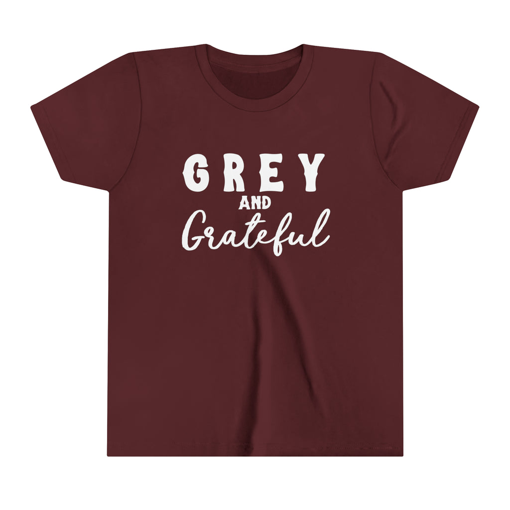 Maroon youth short sleeve with white lettering reading "Grey and Grateful". 