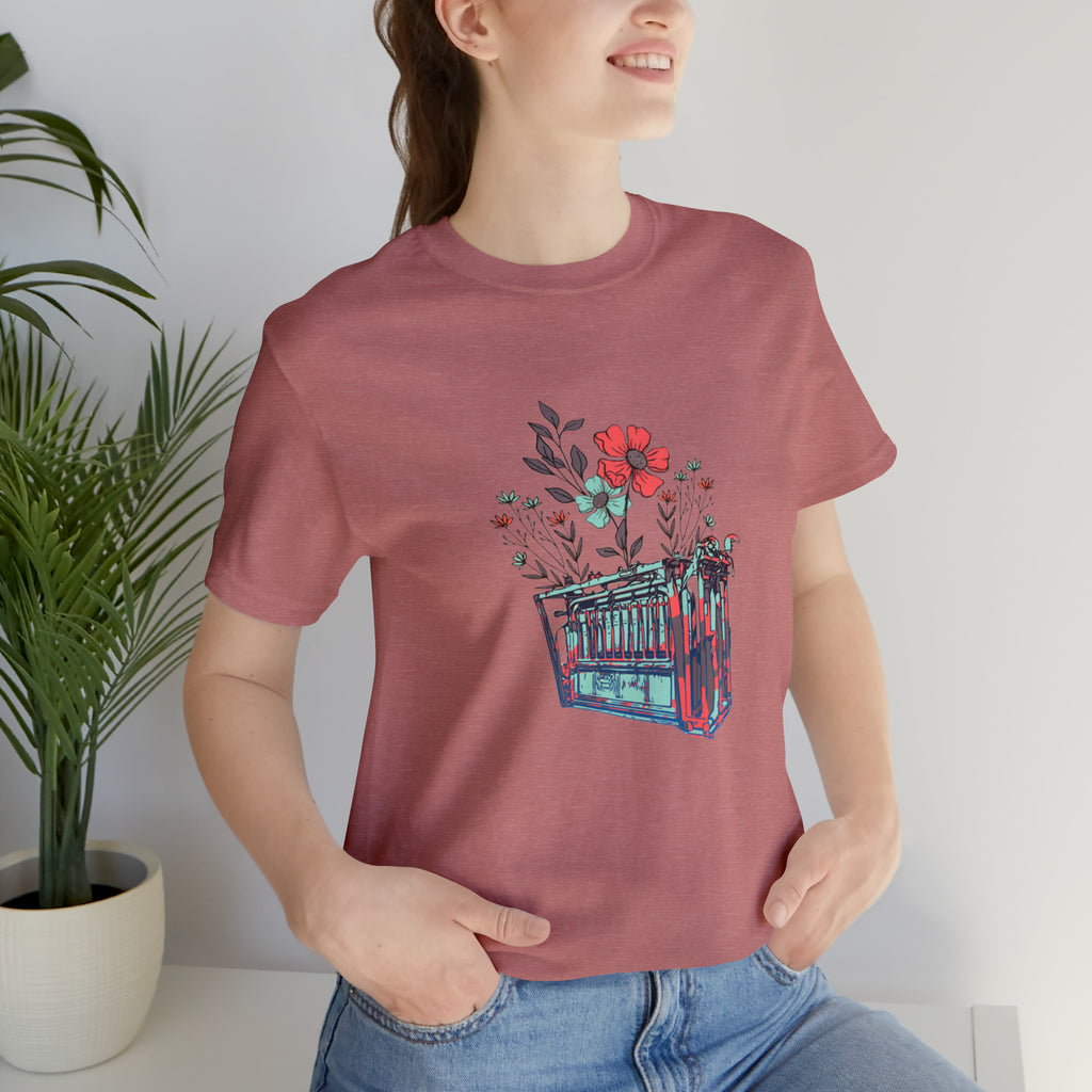 mauve short sleeve with flower teal and pink chute in the middle of the tank. 