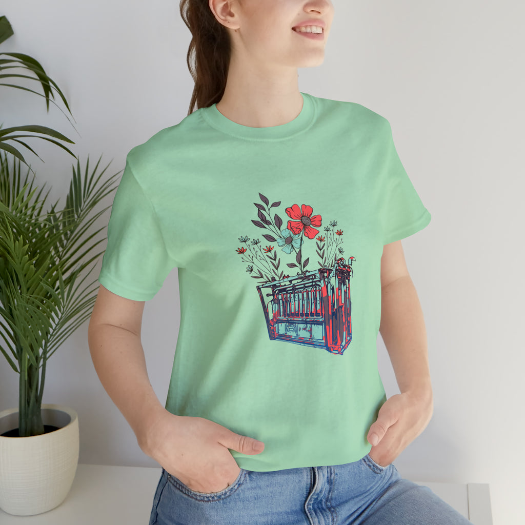 Mint short sleeve with flower teal and pink chute in the middle of the tank. 