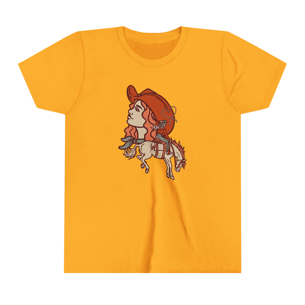 Gold youth short sleeve with a cowgirl printed design and bronc horse with a cowgirl showing a cowgirl's personality. 