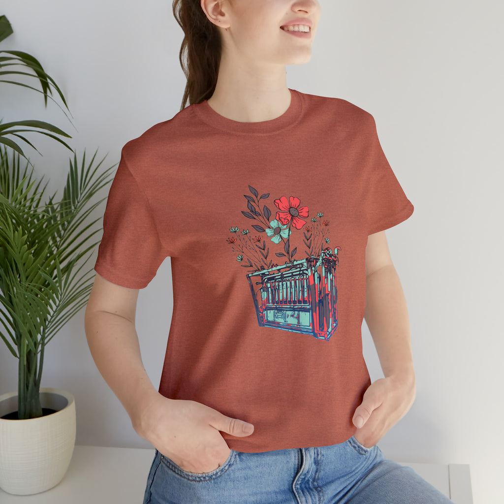 Clay short sleeve with flower teal and pink chute in the middle of the tank. 