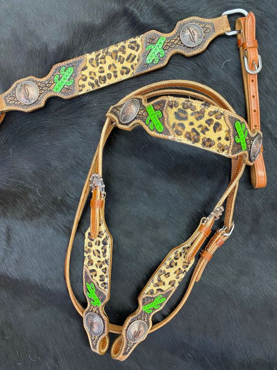 Western headstall set with cheetah inlay and cactus tooled leather designs. Copper cactus conchos accent tooled areas.