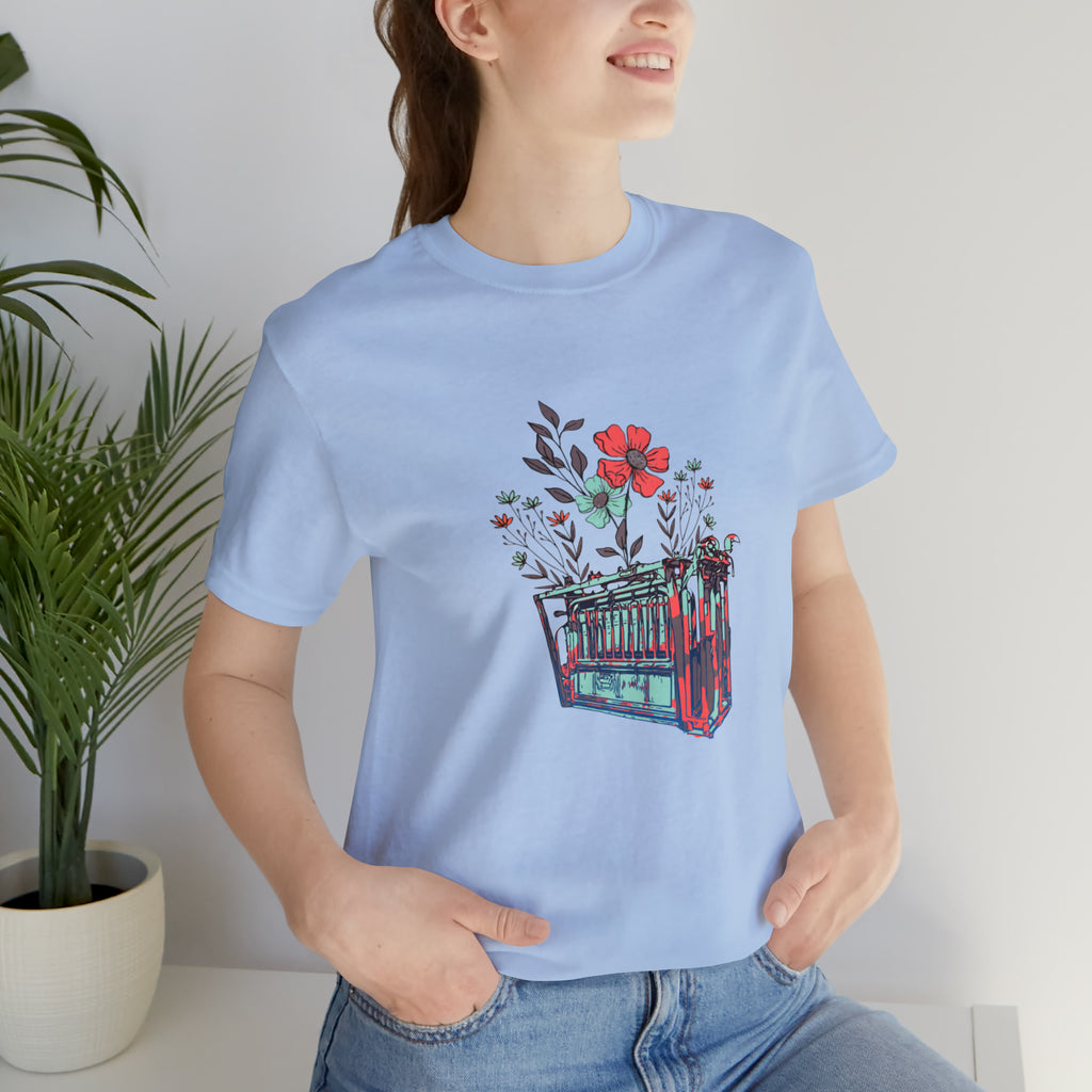 Baby blue short sleeve with flower teal and pink chute in the middle of the tank. 
