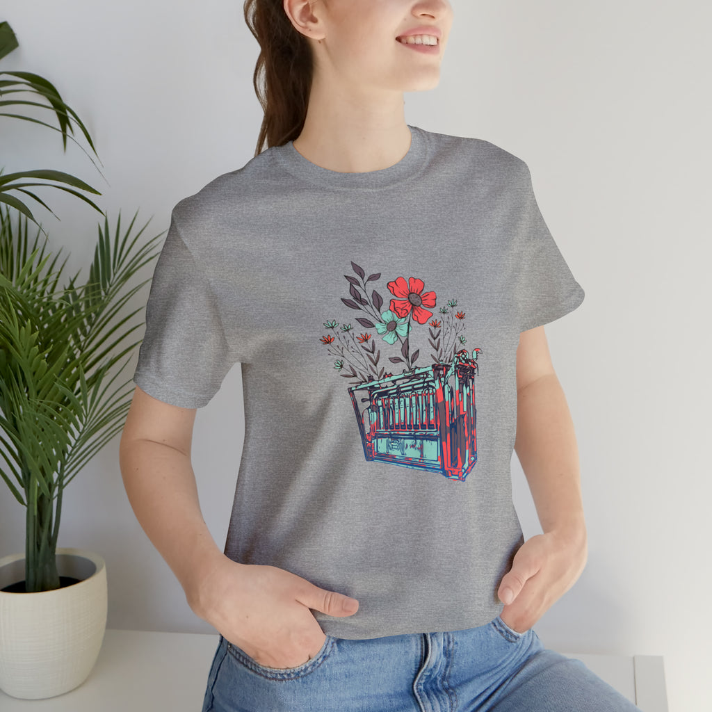 Light grey short sleeve with flower teal and pink chute in the middle of the tank. 