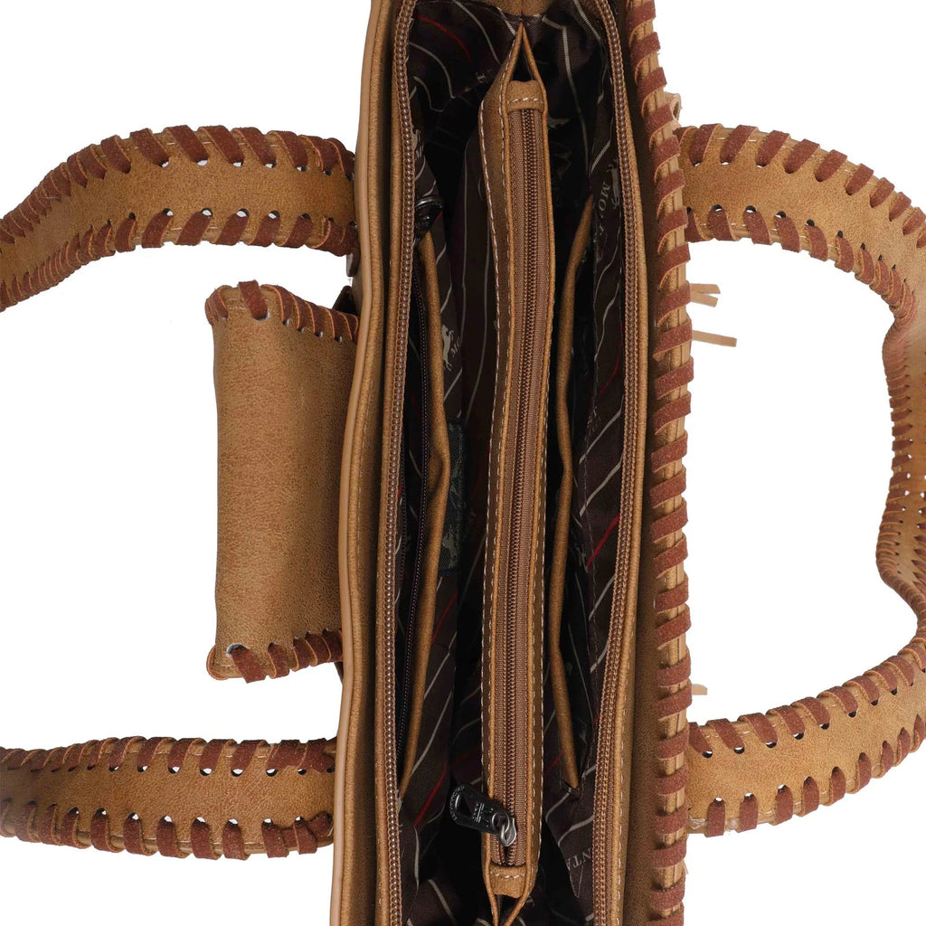 Interior of purse with middle zippered pocket and side pockets. Whip stitch leather handles can be seen. 