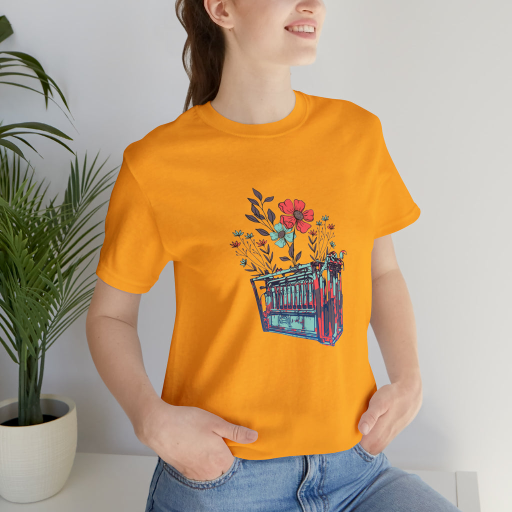 Gold short sleeve with flower teal and pink chute in the middle of the tank. 