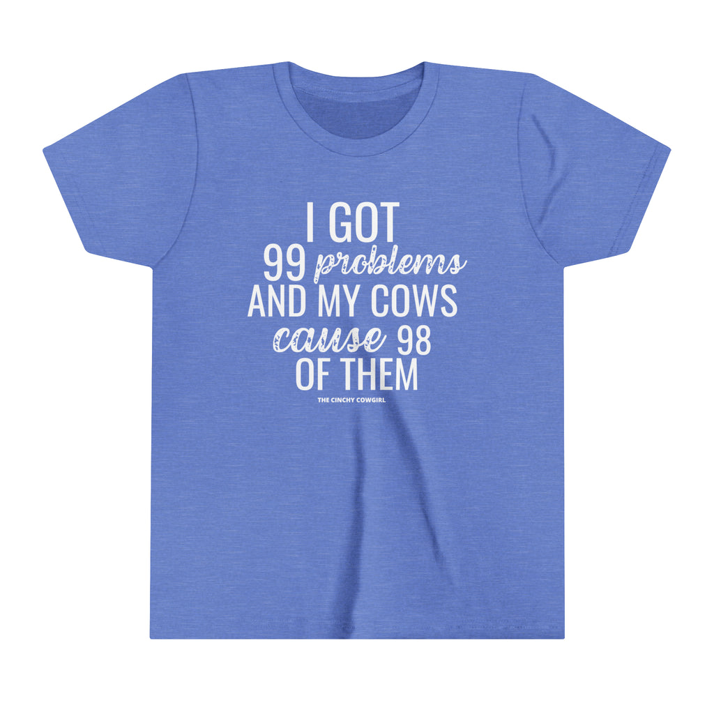 Blue youth short sleeve tee with white lettering reading "I got 99 problems and my Cows cause 98 of them".