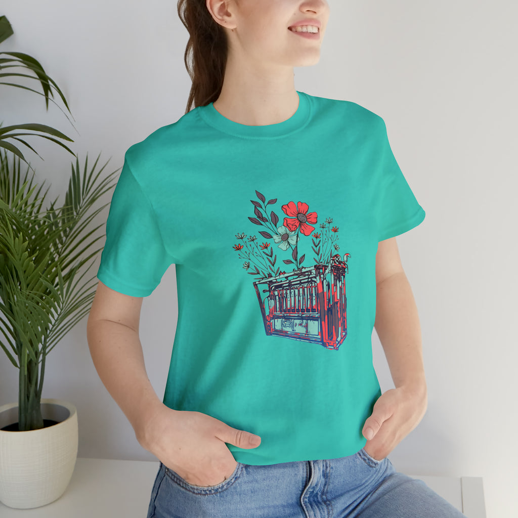 Teal short sleeve with flower teal and pink chute in the middle of the tank. 