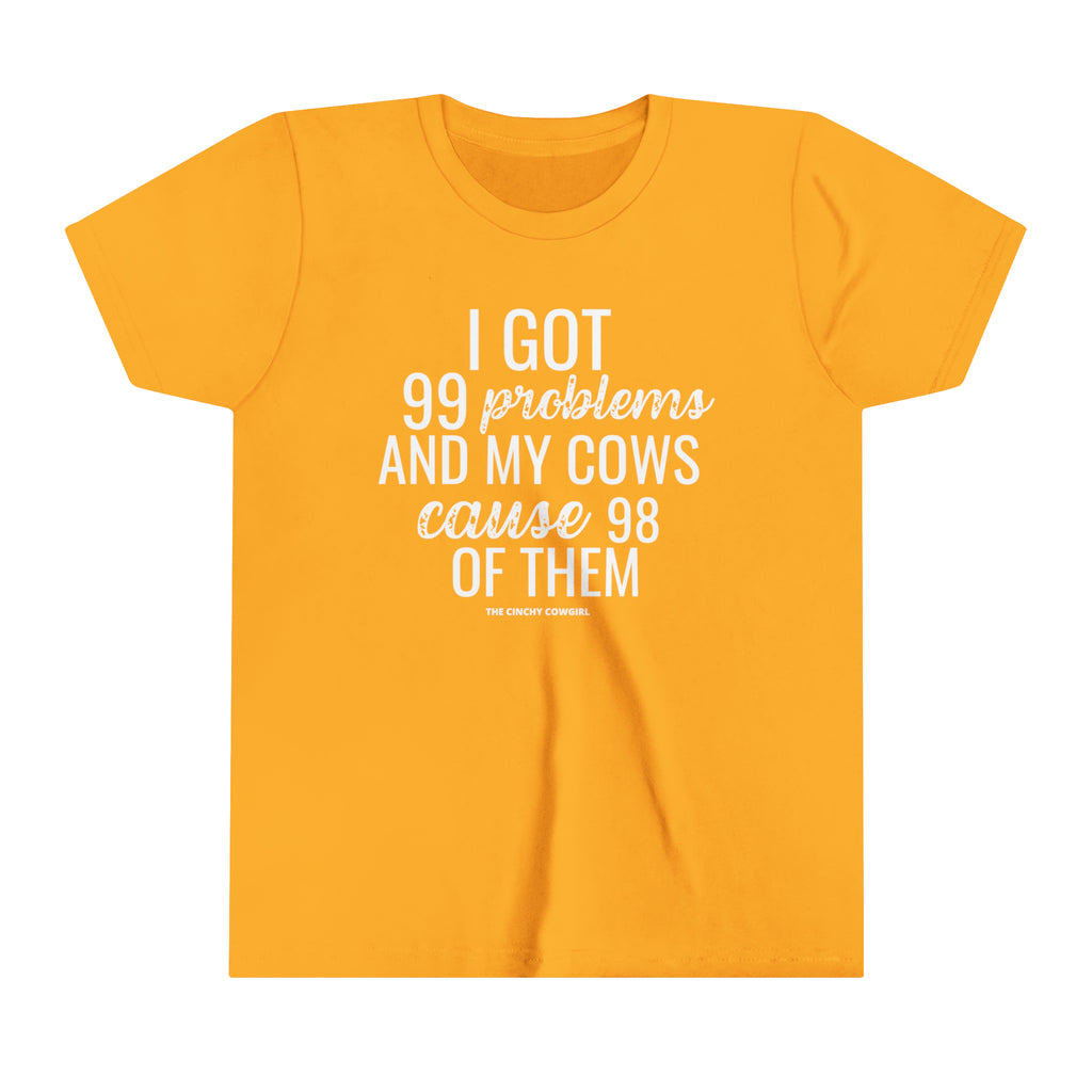 Gold youth short sleeve tee with white lettering reading "I got 99 problems and my Cows cause 98 of them".