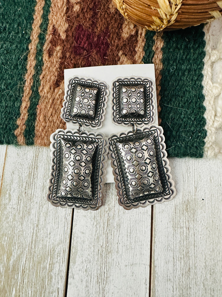Navajo Hand Stamped Sterling Silver Concho Dangle Earrings by Leander Tahe NT jewelry Nizhoni Traders LLC   