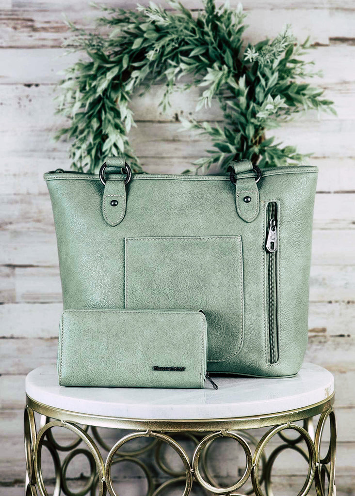 Backside of wallet and handbag set. Concealed handbag has concealed zipper and open pocket for storage. 