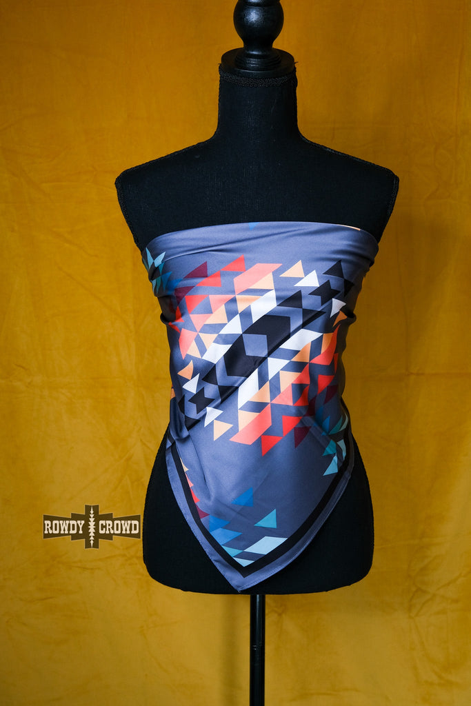 Grey wildrag with southwestern tribal rainbow pattern. Wrapped around a mannequin like a shirt. 