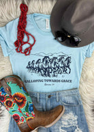 Galloping Towards Grace Short Sleeve Tee with Navy Ink tcc graphic tee The Cinchy Cowgirl