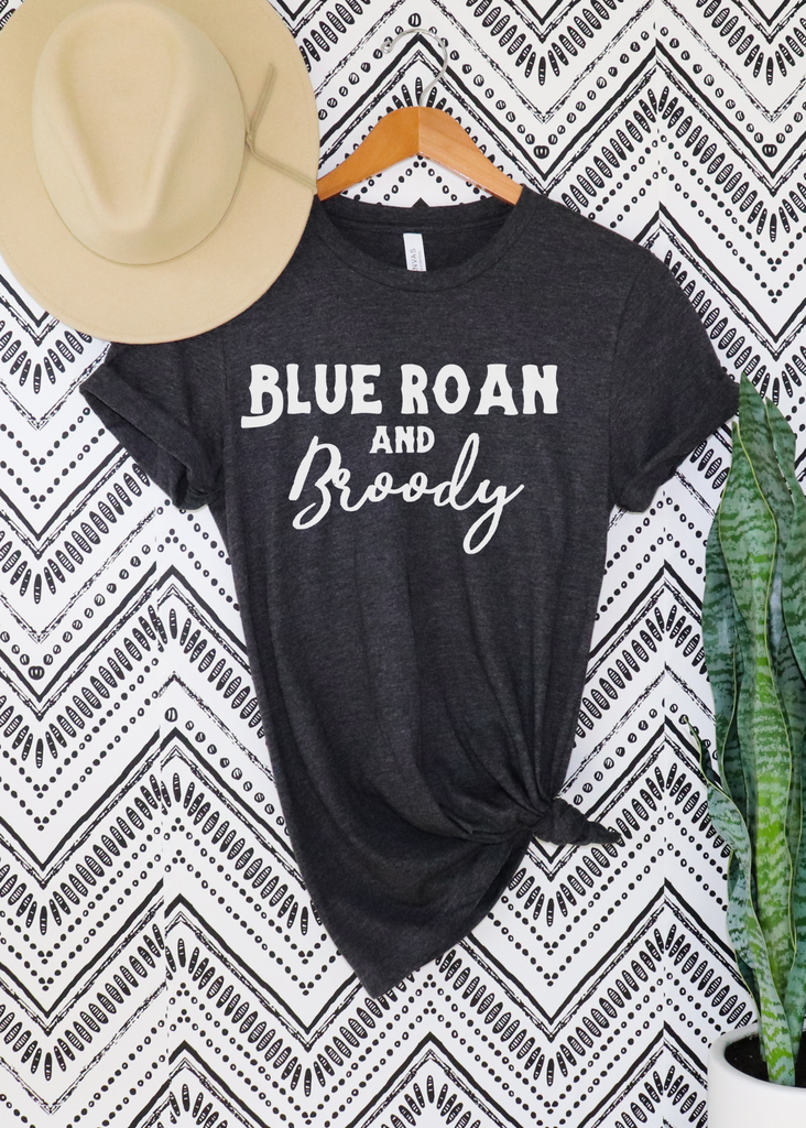 Dark grey short sleeve with white lettering reading "Blue Roan and Broody". 
