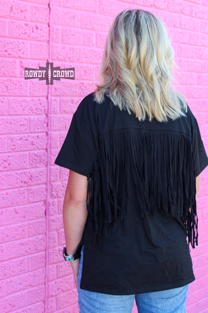 Back of short sleeve western black shirt shows shoulder blade to mid-back fringe. 