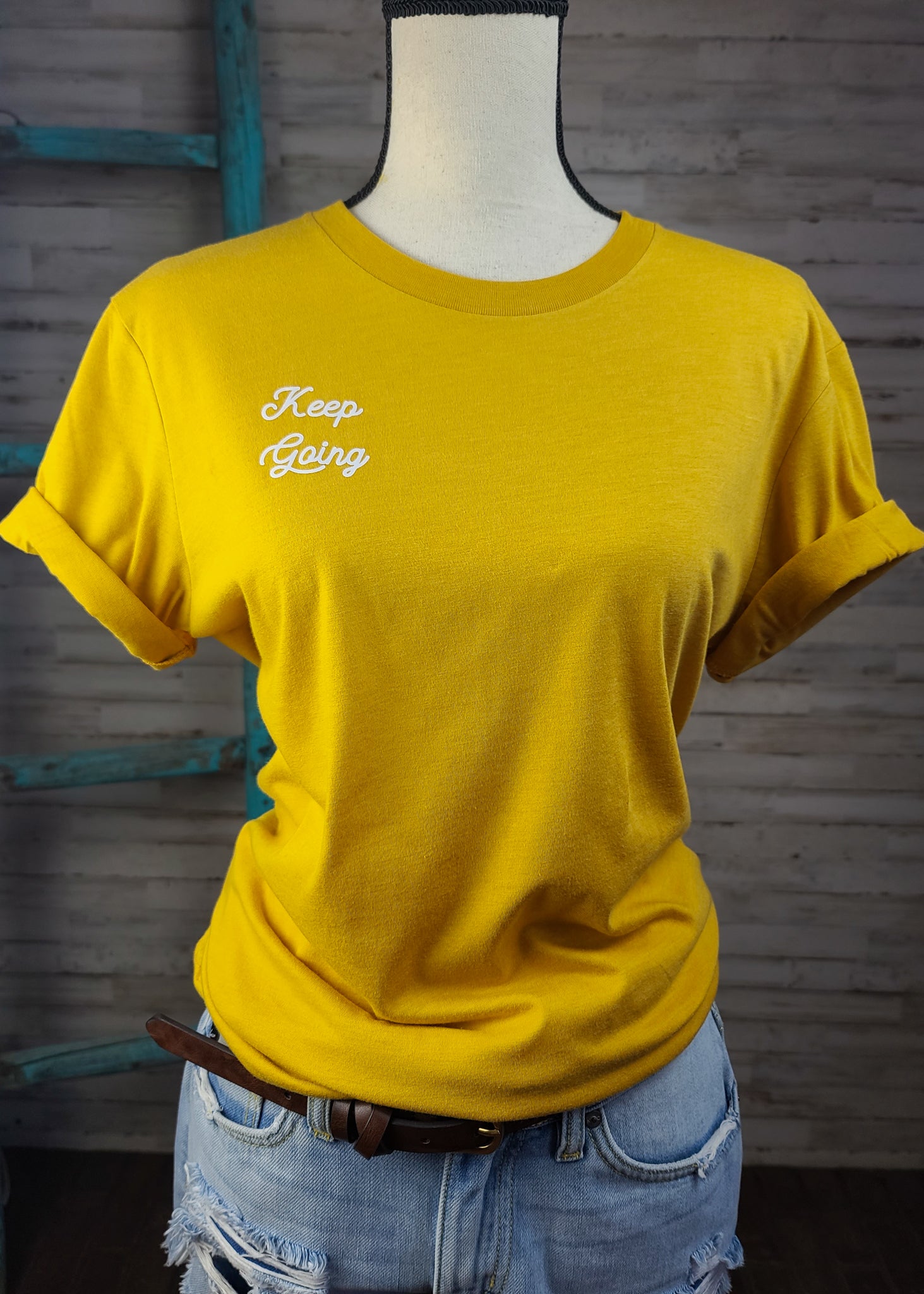 Keep Going Graphic Tee In Mustard tcc graphic tee The Cinchy Cowgirl